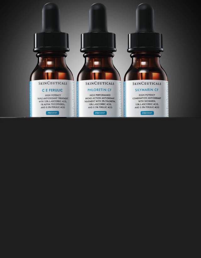 Ein Bild von drei braunen Glasflaschen mit Pipettenaufsatzen, die ein Hautpflegeprodukt von SkinCeuticals namens "C E Ferulic" enthalten. Der Hintergrund ist dunkel, wodurch die Flaschen hervorstechen.