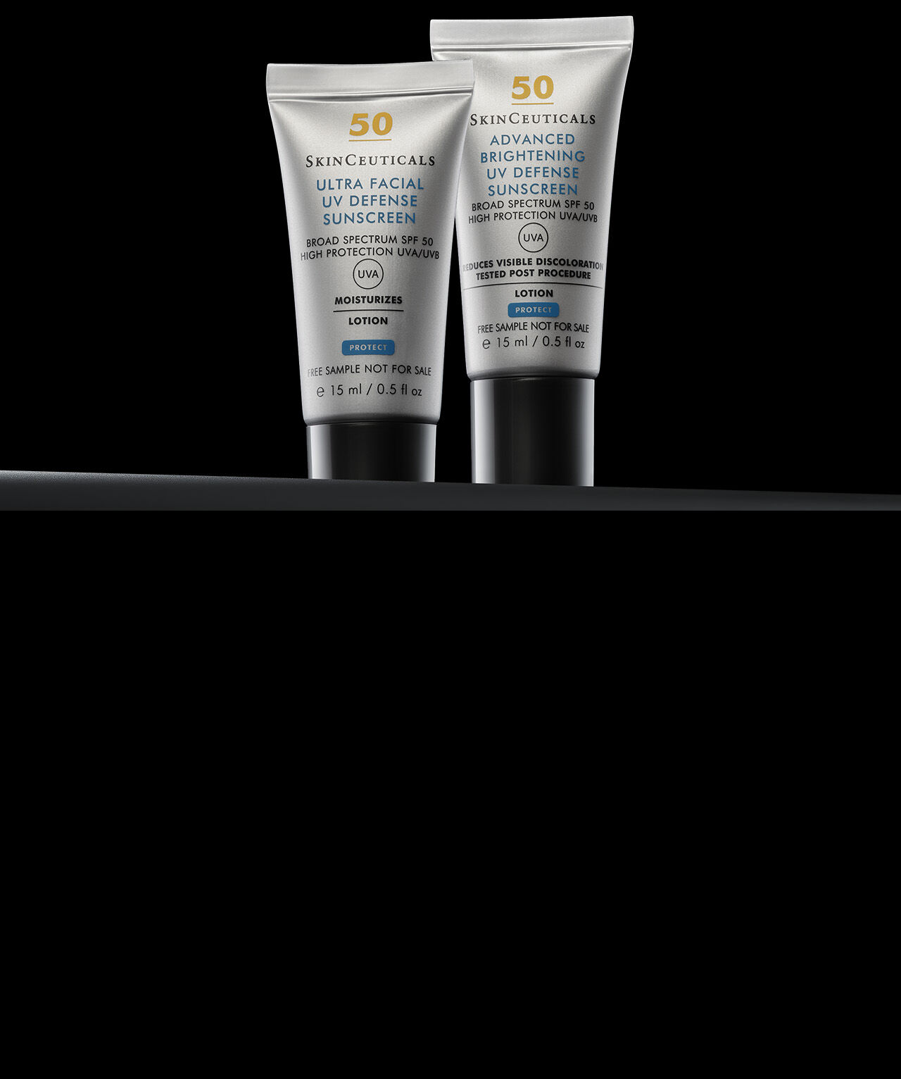 Nahaufnahme von zwei Flaschen Sonnenschutzmittel von Skinceuticals, einem Ultra Facial UV Defense und einem Advanced Brightening UV Defense, auf schwarzem Hintergrund.