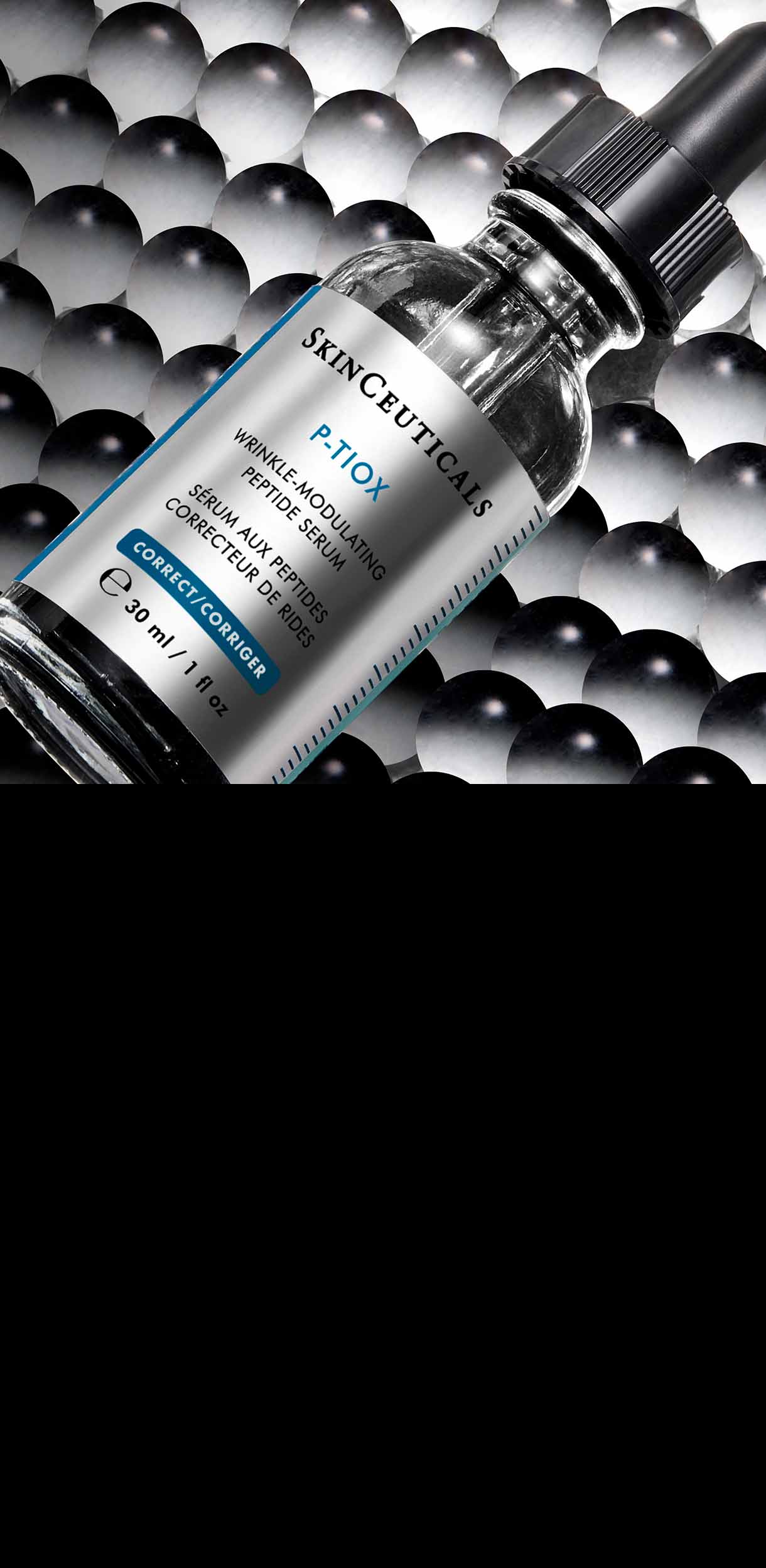 Eine Flasche SkinCeuticals Discoloration Defense Serum liegt schräg auf einem Hintergrund aus dicht gepackten, glänzenden schwarzen und grauen Kugeln, was eine texturierte und wissenschaftliche Ästhetik erzeugt.
